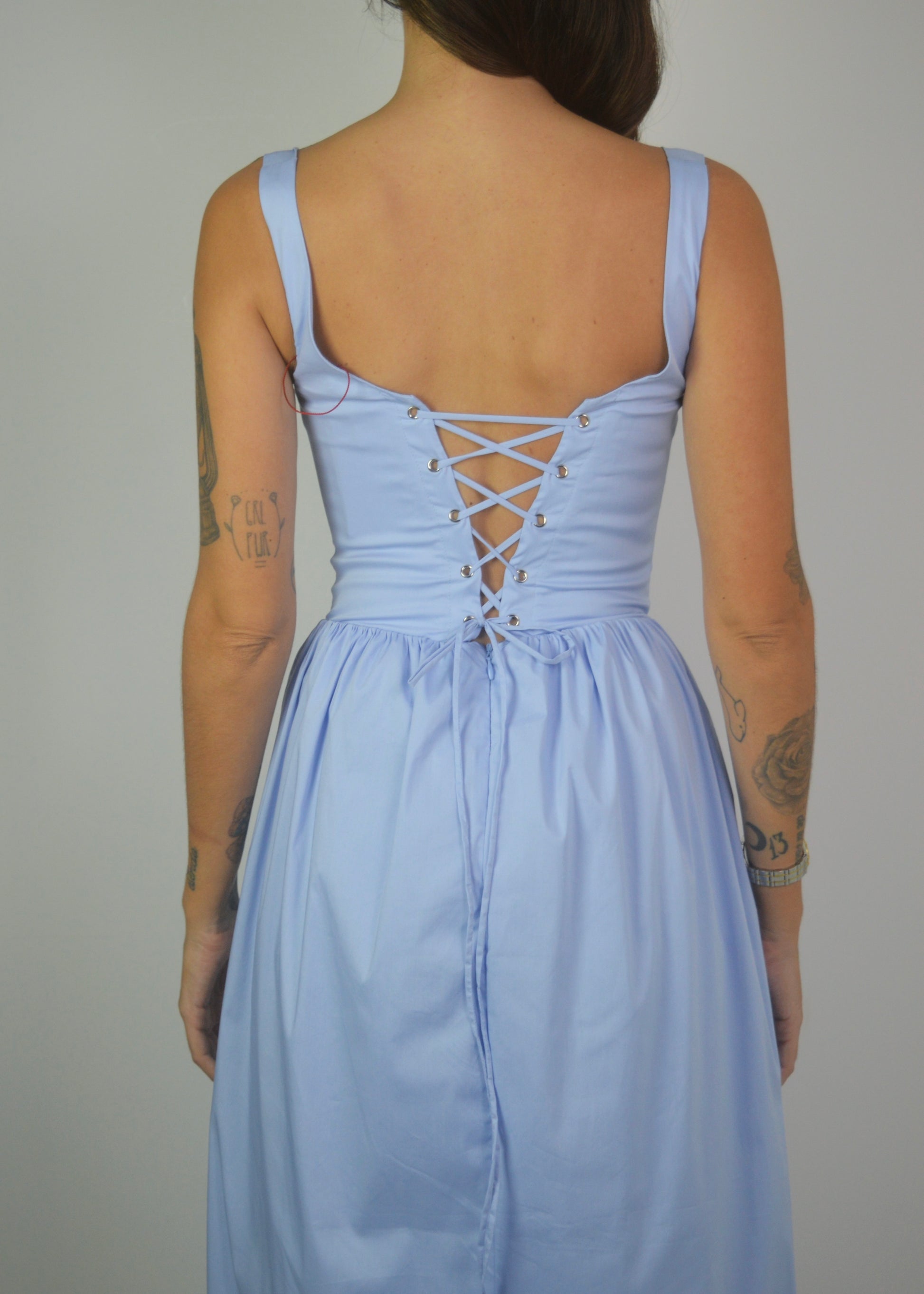 reina blue drop waist corset midi dress With built-in cups, a lace-up back, and pockets Timeless charm meets comfort and support in our Reina Drop Waist Corset Midi
